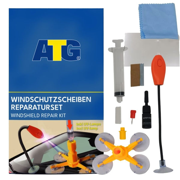 Die Verpackung des ATG® Steinschlag-Reparatursets mit UV-Licht mit der Aufschrift „ATG® Steinschlag-Reparaturset mit UV-Licht“ enthält eine Reparaturspritze, eine UV-Lampe, eine Saugnapfhalterung, einen Harzbehälter und ein blaues Reinigungstuch – und bietet damit alles, was Sie zur Steinschlag-Reparatur mit diesem DIY-Reparaturset der ATG GmbH & Co. KG benötigen.