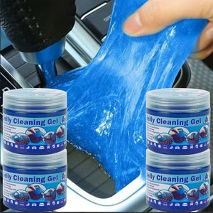 Eine Hand reinigt den Getriebebereich eines Autos mit ATG® Jelly Cleaning Gel der ATG GmbH & Co. KG, im Vordergrund sind vier Behälter des ATG® Jelly Cleaning Gel | 4er Set zu sehen.